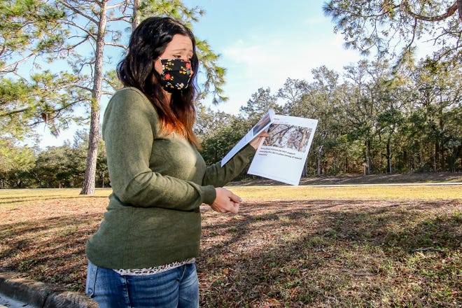 Gulf Breeze resident Abbey Rodamaker holds her petition