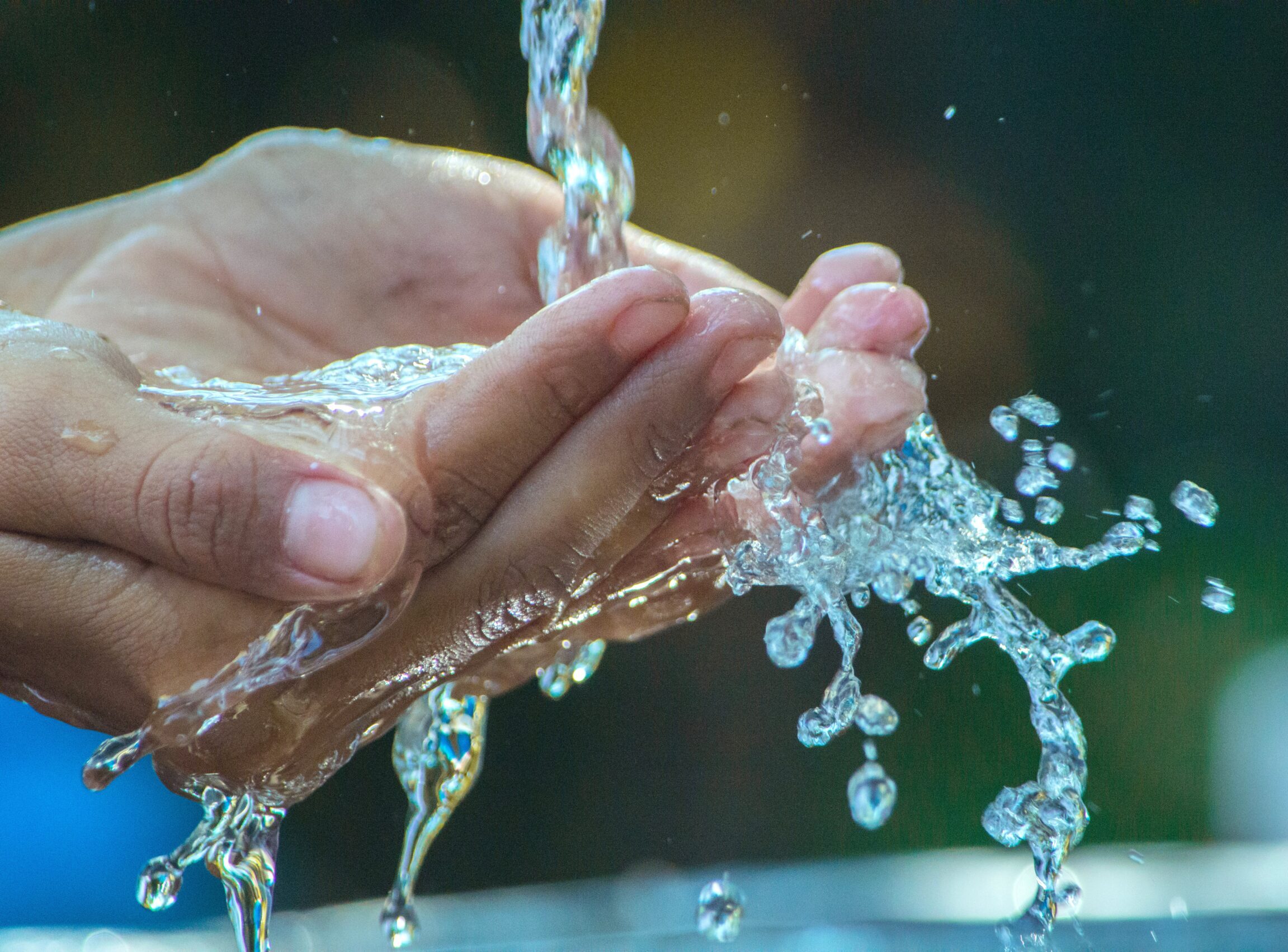 Water falls on cupped hands